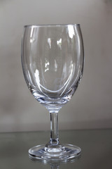 Transparent glass of wine on the floor