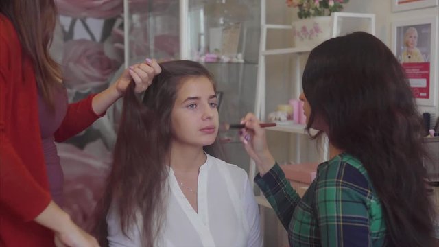 Hairstylist and make-up artist working at model image 4K