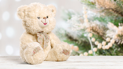Teddy Bear toy alone on wood