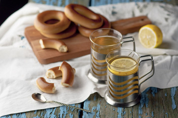 Mug of tea with bagels on a wooden background