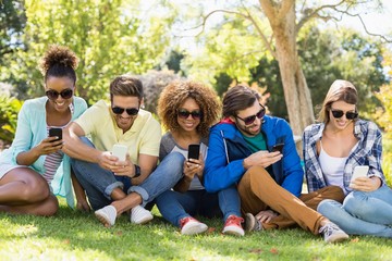 Group of friends using mobile phone