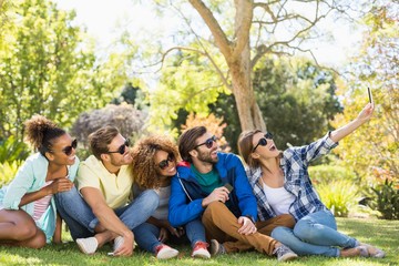 Fototapeta premium Group of friends taking a selfie with the mobile phone