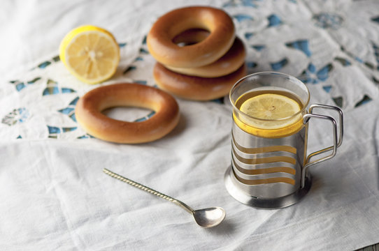 Mug of tea with bagels on a wooden background