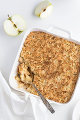 apple crumble pie in white baking dish