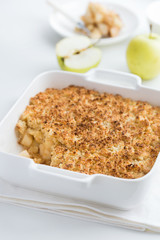 apple crumble pie in white baking dish