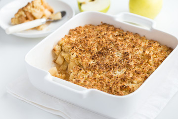 apple crumble pie in white baking dish