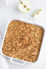 apple crumble pie in white baking dish