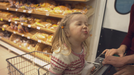 Family makes purchases in the supermarket