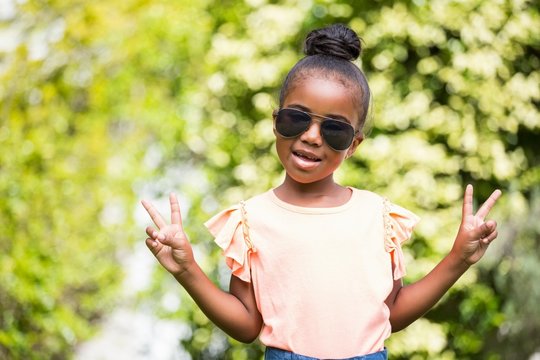 Little girl with sunglasses at park