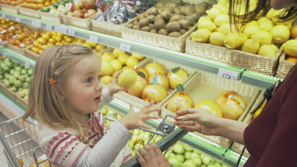 Family makes purchases in the supermarket