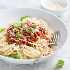 Spaghetti pasta with bolognese sauce and  parmesan cheese