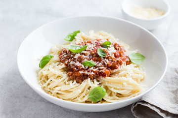 Spaghetti pasta with bolognese sauce and  parmesan cheese