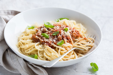 Spaghetti pasta with bolognese sauce and  parmesan cheese