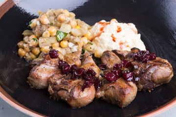 Fried lamb tongues with garnish