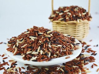 Riceberry /
Organic Riceberry  from Thailand on a plate  basket  background
