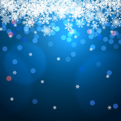 winter background with bokeh and snowflakes