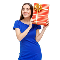 Beautiful woman holding gift box