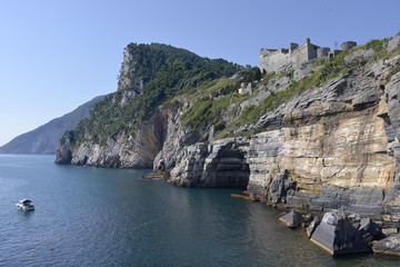 Rocky coastline and Doria castle on the cliff at Portovenere (or Porto Venere), is a town and...