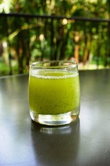 Healthy fresh green juice with pineapple and mint
