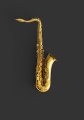 Fototapeta na wymiar Saxophone on color background