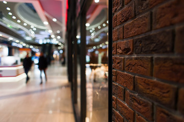 bright mall interior, preparig for celebrating christmas, brick wall