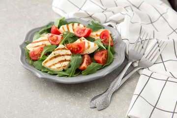 fresh salad with fried cheese, tomatoes and arugula