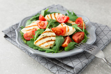 fresh salad with fried cheese, tomatoes and arugula