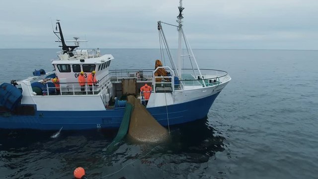Flying Around Commercial Fishing Ship with Trawl Net full of Fish. Shot on RED Cinema Camera in 4K (UHD). 