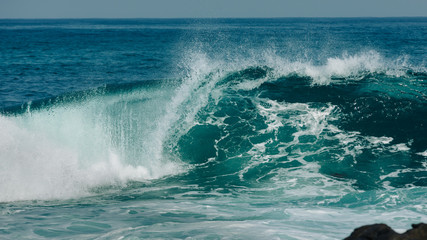 Massive rolling waves crashing into the rocks near Margaret beach, Western Australia
