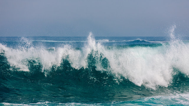 Massive rolling waves crashing into the rocks near Margaret beach, Western Australia