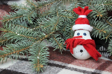 Snowman near the Christmas tree