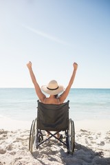 Wheelchair woman sitting  with arms up 