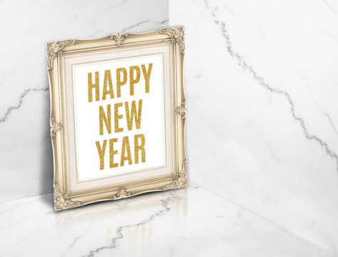Happy new year word on vintage golden photo frame at white gloss