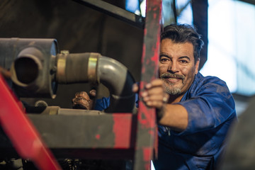 Mechanic working at fire brigade workshop, portrait