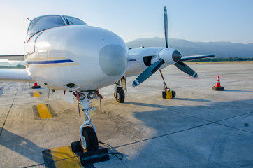 Close up Small Airplane or Aeroplane Parked at Airport.Small Airplane Famous to use Private Airplane.Sunset Light.