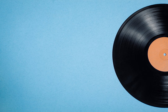 vinyl musical disc on blue background;
