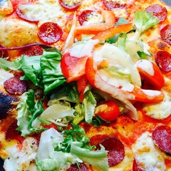 Thin crust Pepperoni pizza with salad and dressing