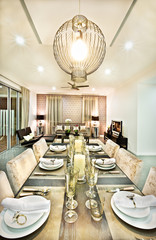 Dining room close up with chairs and glasses at night