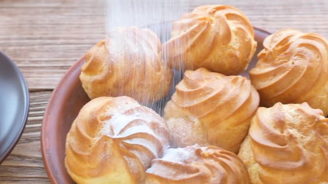 Delicious profiteroles with cream dessert.