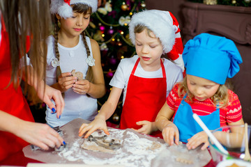 children baking christmas cookies