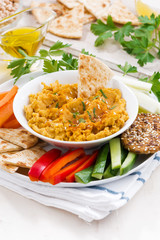 Arabic sauce hummus with fresh vegetables and pita bread