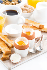 delicious breakfast with boiled eggs and crispy toasts, top view