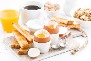 delicious breakfast with boiled eggs and crispy toasts