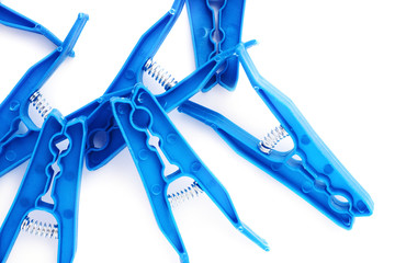 Pile of plastic cloth pegs isolated over white background