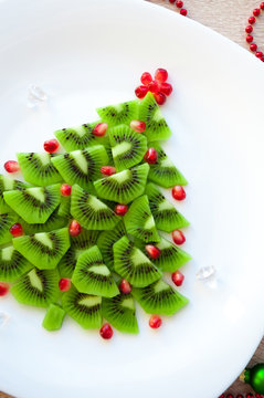 Fruit Kiwi Christmas tree - New Year food background top view blank space for text