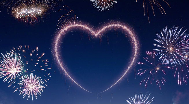 Night sky with fireworks shaped as a heart.(series)