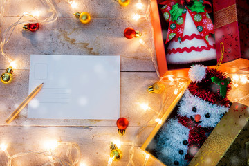 Fototapeta premium Merry Christmas .snowing and happy new year event on wood . Open Warm white light. Filter effect