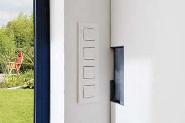 Light Switch near a sliding door in a modern apartment