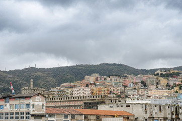 city of Genoa on the hills under a cloudy sky