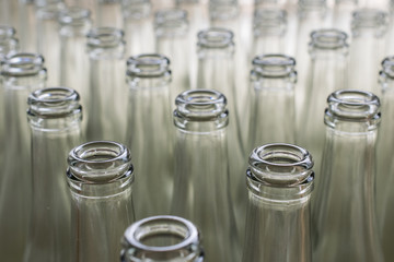 pile of empty transparent glass bottles